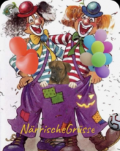 Due clown che si abbracciano e si divertono